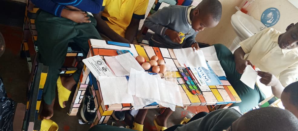 Group learning activity with children and teacher