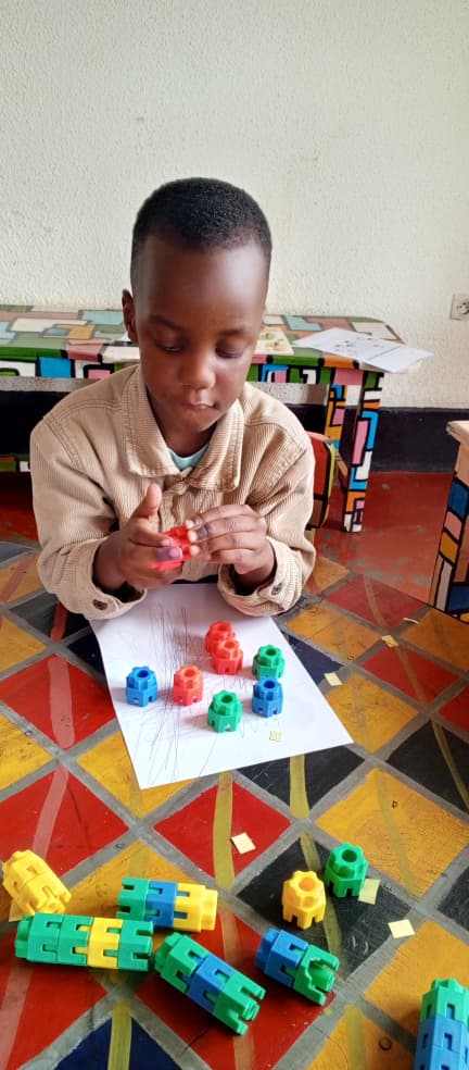 Child with autism engaged in one-on-one learning with teacher