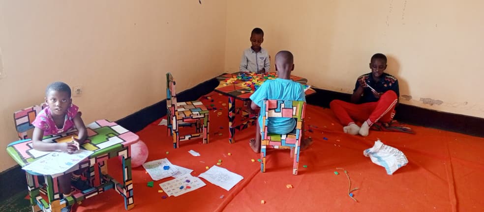 Child working on fine motor skills with educational materials